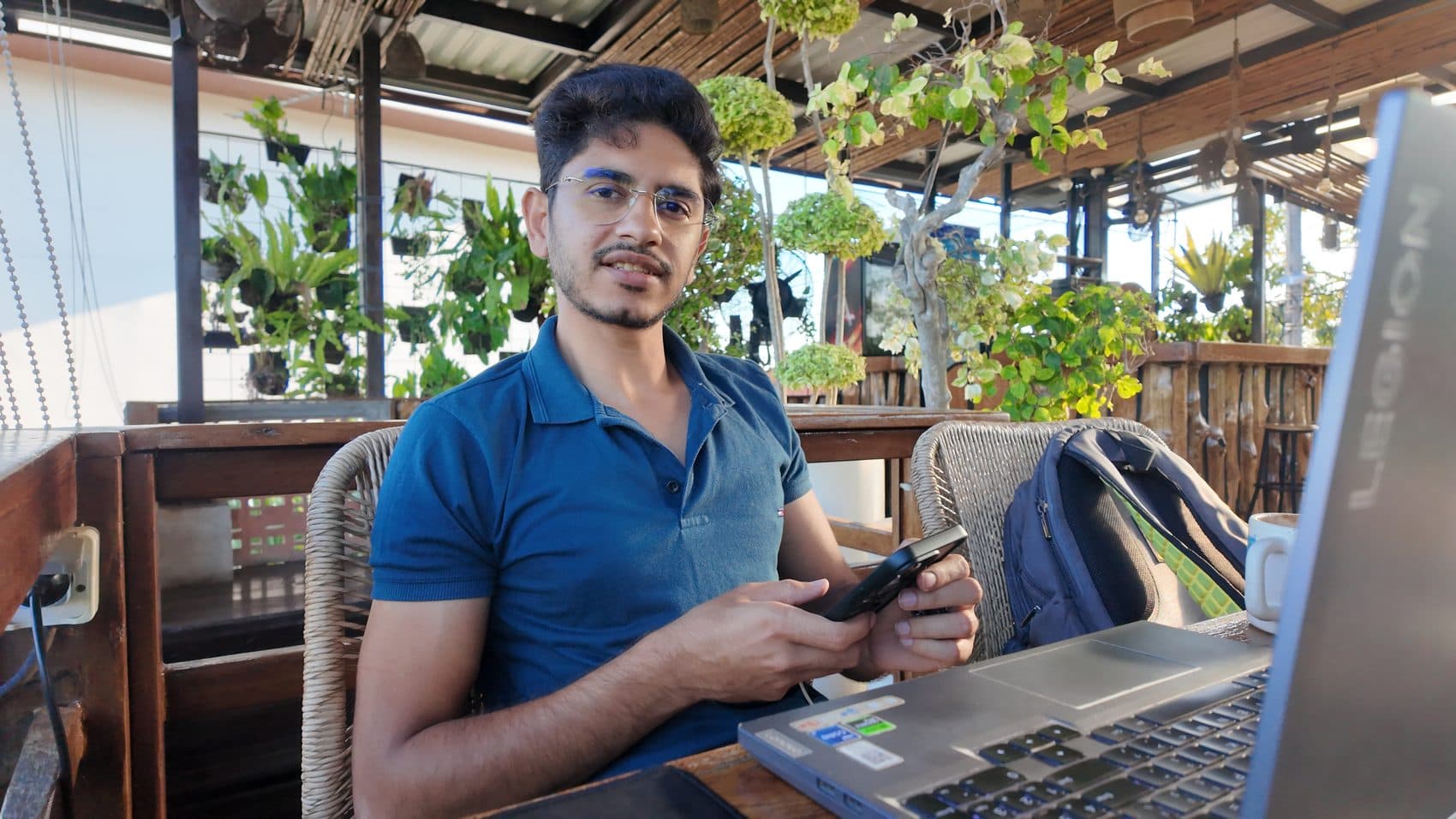 Waseem Nasir building on a laptop at a cafe